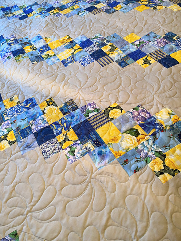 Grannies Quilt has a hint of purple in the flowers